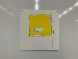 ホワイトボードに貼られた地図のようなもの